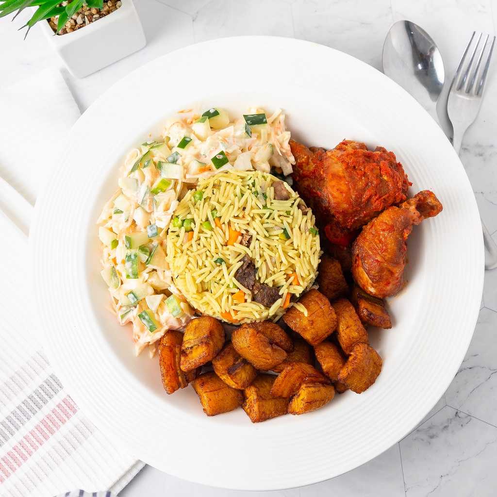 Fried Rice, salad, plantain, and chicken 